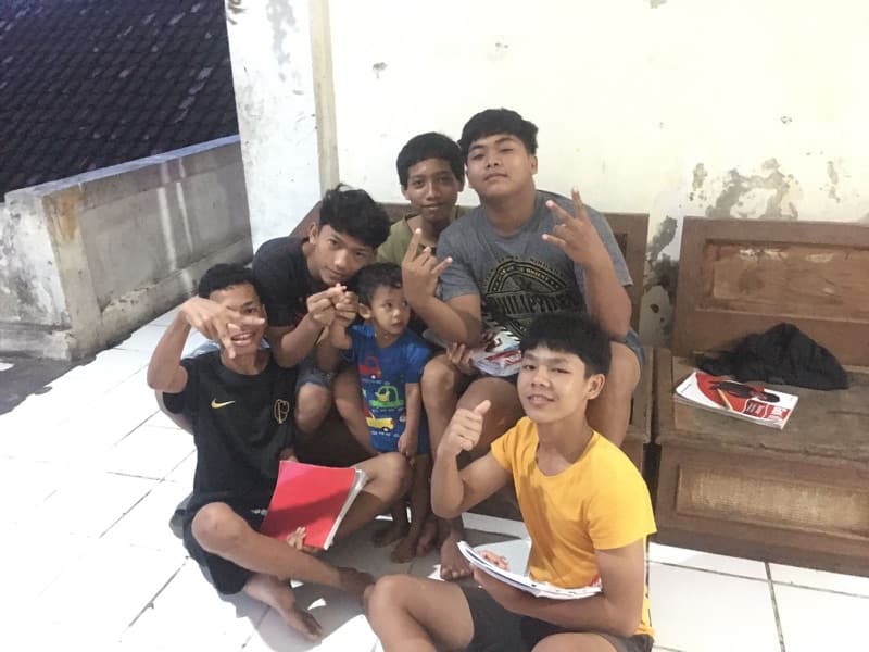 Teacher working with children at Seeds of Hope orphanage in Bali